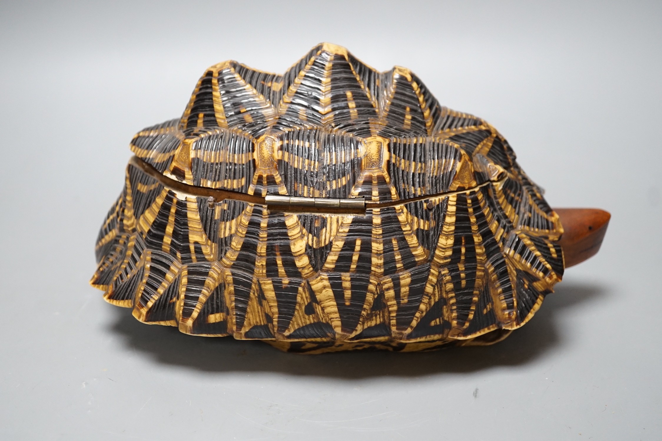 Early 20th century Ceylonese tortoise trinket box, with marquetry inlaid interior, 24.5 cm wide